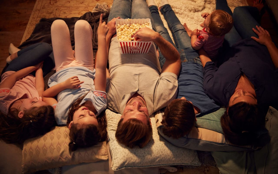 A Family eating popcorn together